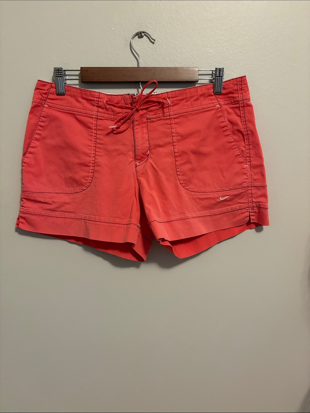 Nike Womenβs Coral-Red Drawstring Athletic Shorts